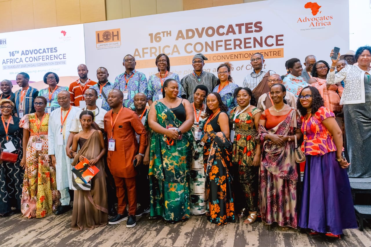 Participants gathered in front of the 16th Advocates Africa conference banner